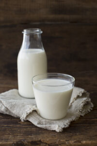 Picture of pitcher of milk and a glass of milk
